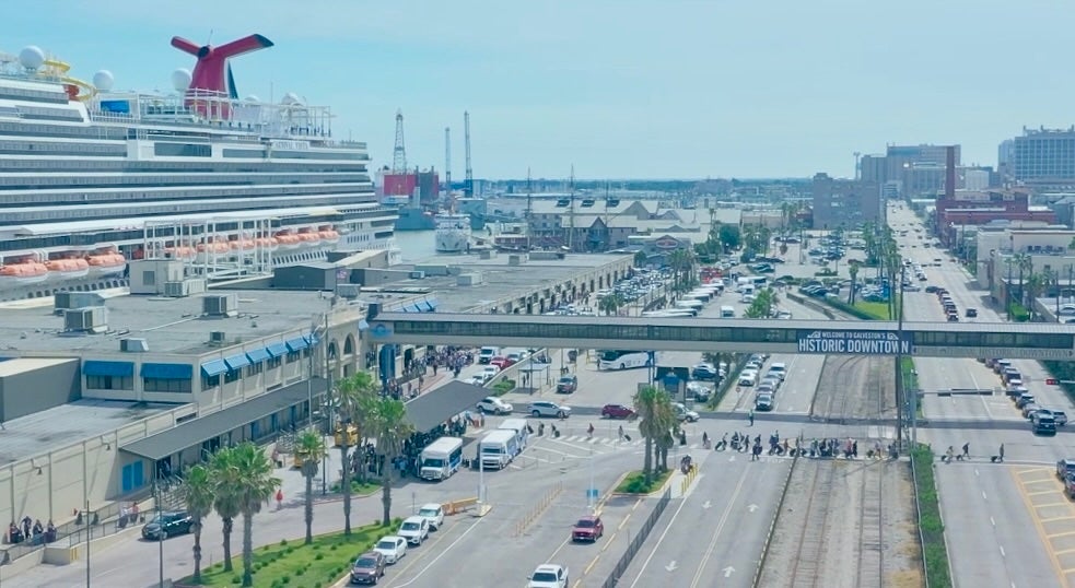 Cruise passengers crossing Harborside at 25th Street to board a Carnival ship.