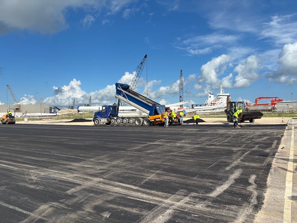 A C&M crew does paving work at the cruise parking Express lot.